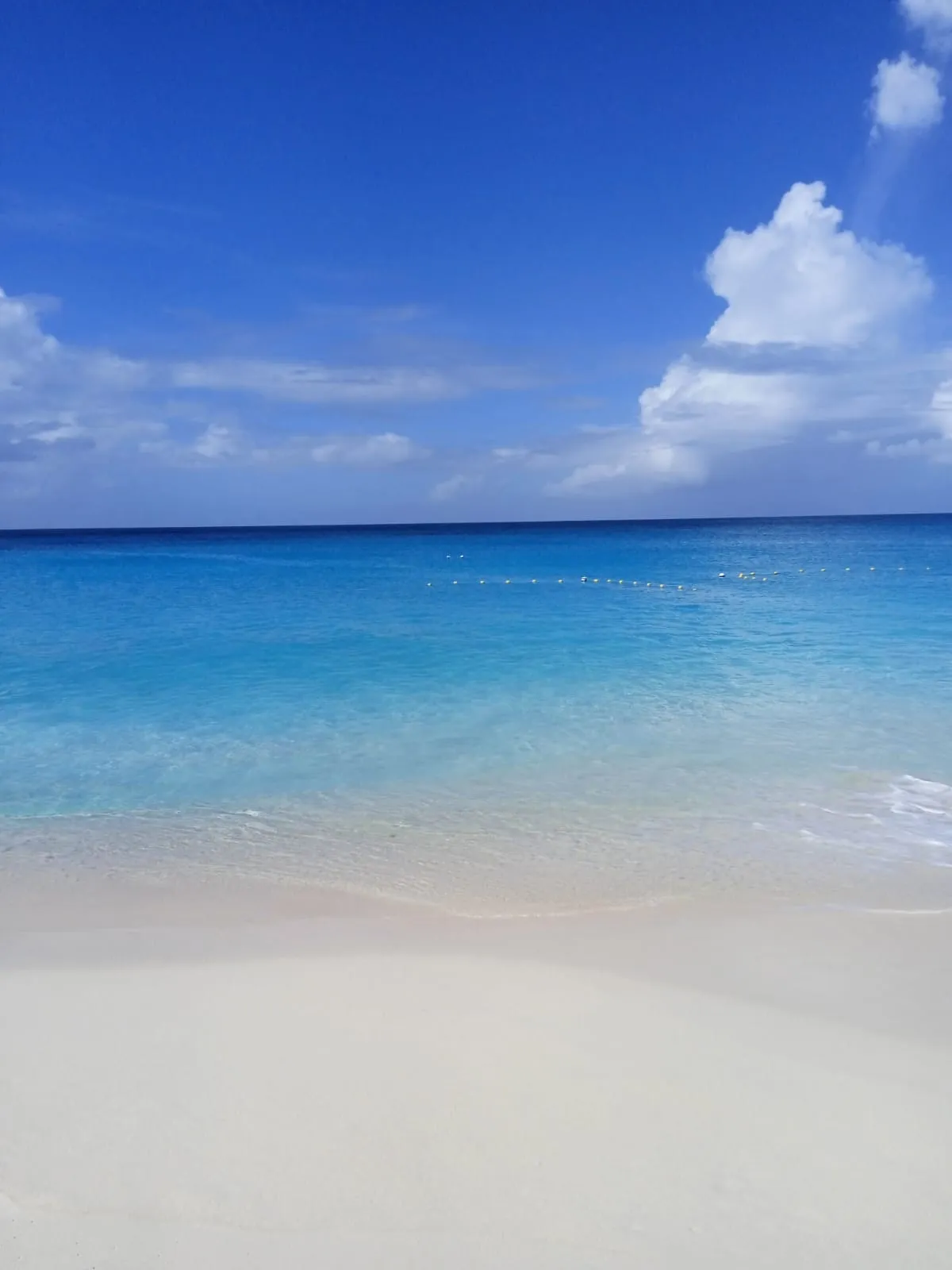 Crystal-clear turquoise Caribbean waters on white sand beach