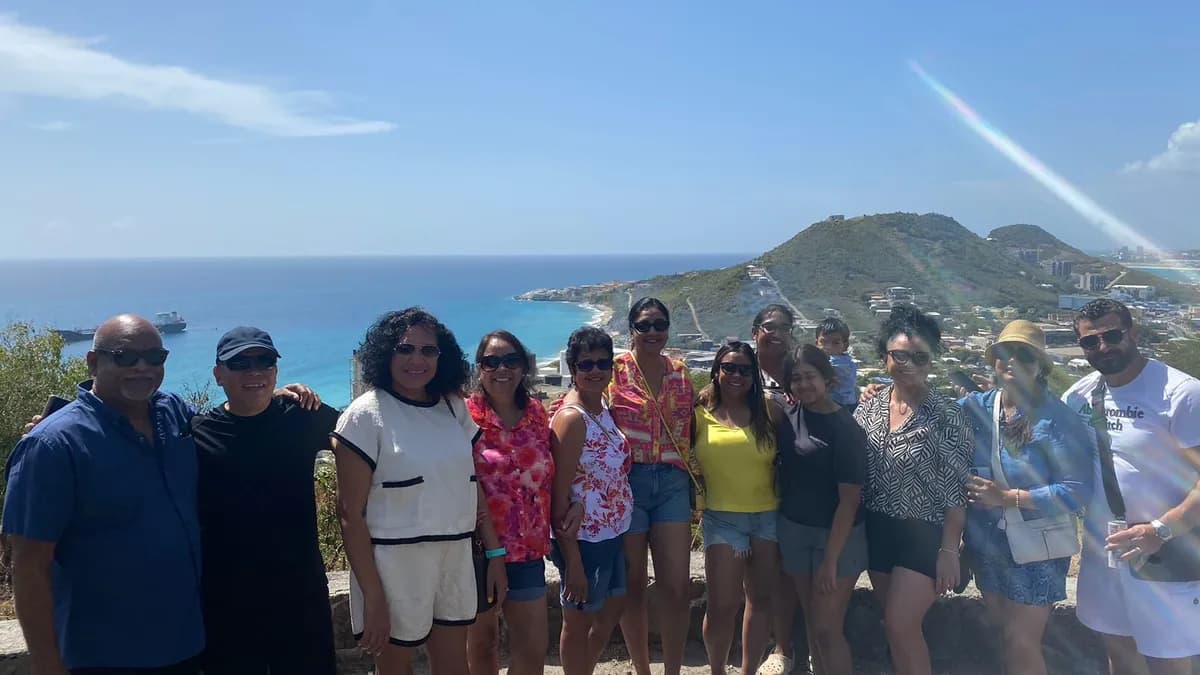 Tour group enjoying panoramic views from a St. Maarten hilltop